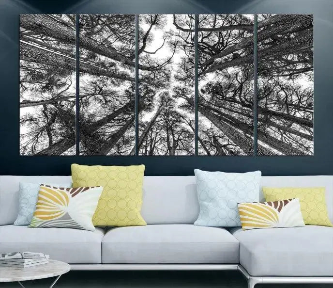 The "Trees Contemporary Art Canvas Print" is a striking black and white triptych featuring tall trees viewed from below. This artwork is gallery wrapped on museum-quality canvas, complete with a UV-protective coating to ensure its longevity.