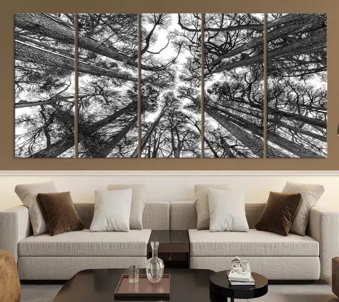 The "Trees Contemporary Art Canvas Print" is a striking black and white triptych featuring tall trees viewed from below. This artwork is gallery wrapped on museum-quality canvas, complete with a UV-protective coating to ensure its longevity.