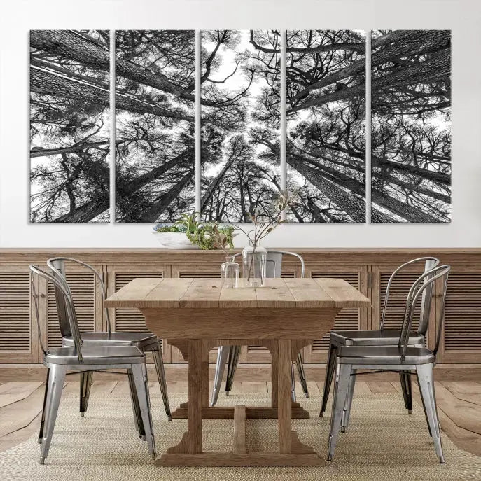 The "Trees Contemporary Art Canvas Print" is a striking black and white triptych featuring tall trees viewed from below. This artwork is gallery wrapped on museum-quality canvas, complete with a UV-protective coating to ensure its longevity.