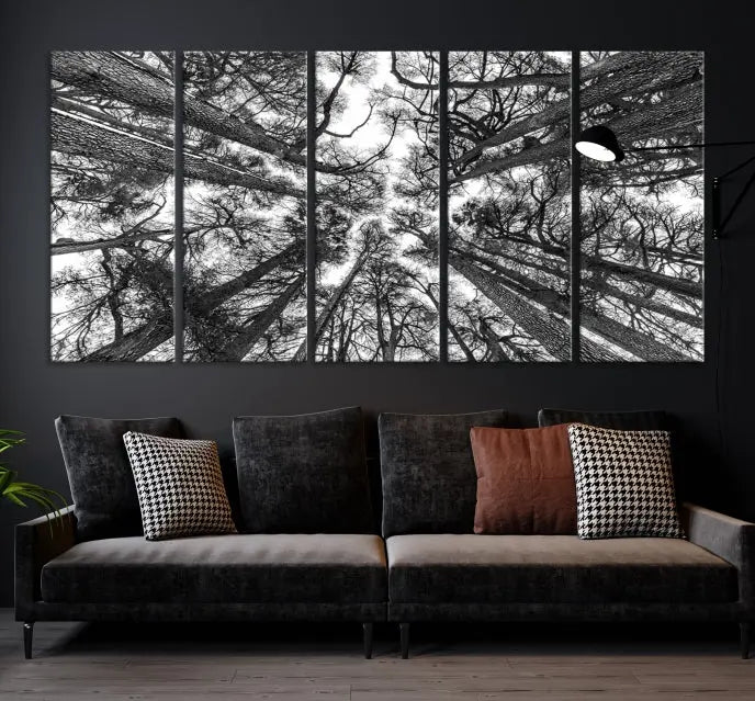 The "Trees Contemporary Art Canvas Print" is a striking black and white triptych featuring tall trees viewed from below. This artwork is gallery wrapped on museum-quality canvas, complete with a UV-protective coating to ensure its longevity.