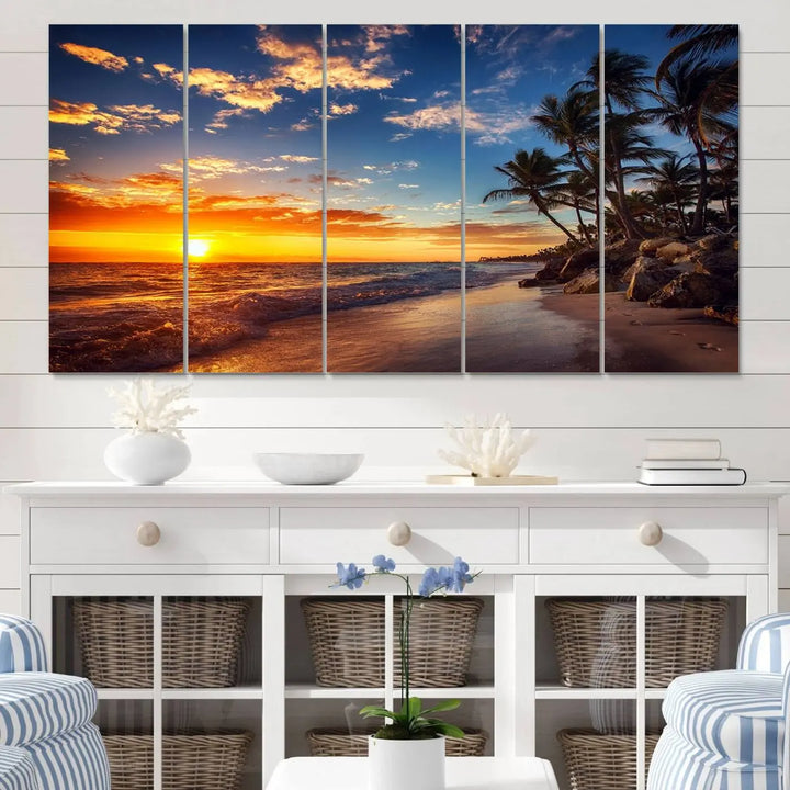 The Tropical Beach Sunset Canvas Art, featuring palm trees and ocean waves, brings an inviting atmosphere to coastal-themed homes.