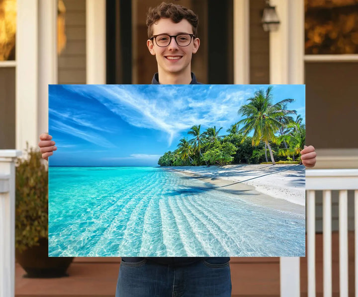 The Tropical Beach Wall Art Canvas Print showcases a serene ocean landscape with crystal clear turquoise water and palm trees, beautifully enhancing the coastal decor.