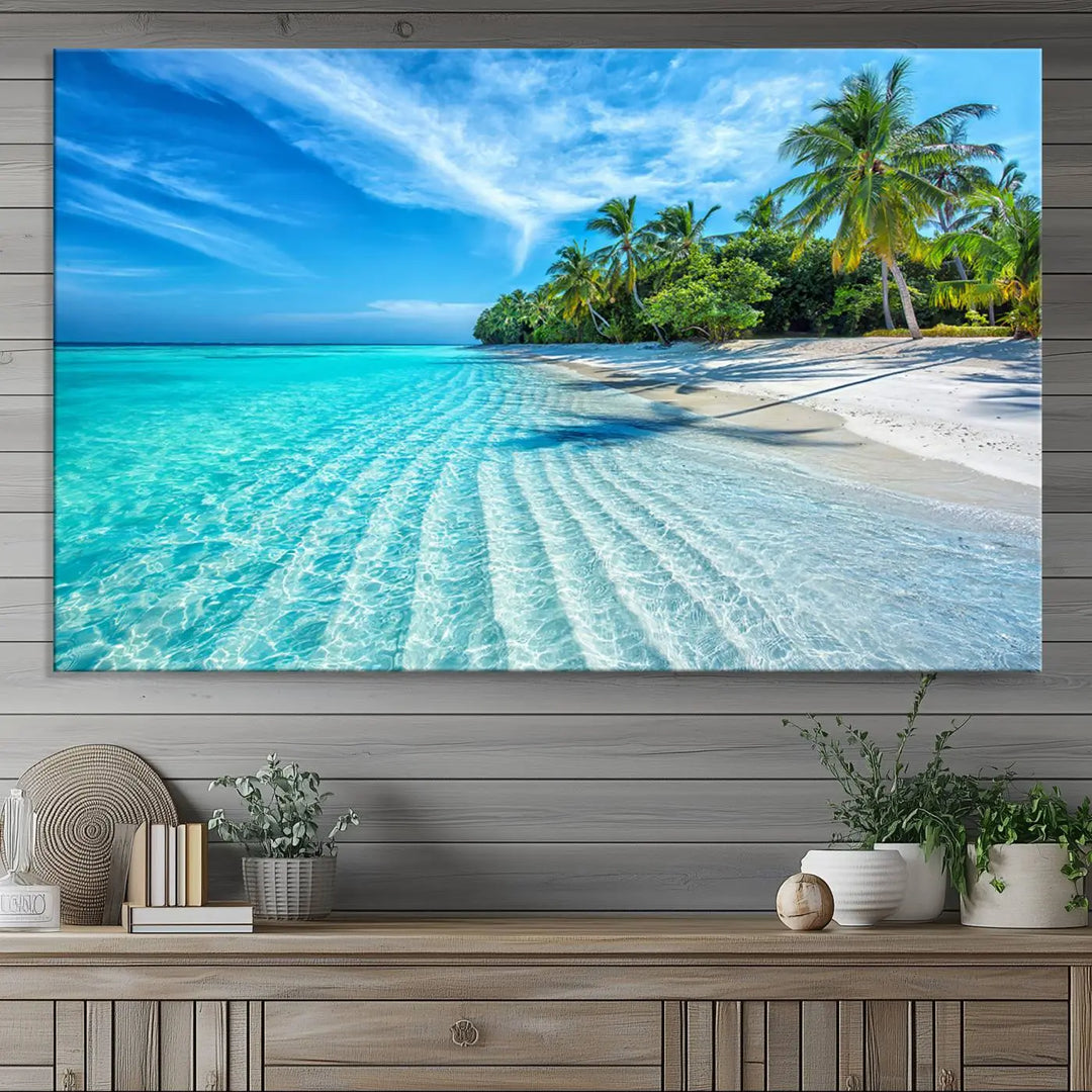 The Tropical Beach Wall Art Canvas Print showcases a serene ocean landscape with crystal clear turquoise water and palm trees, beautifully enhancing the coastal decor.