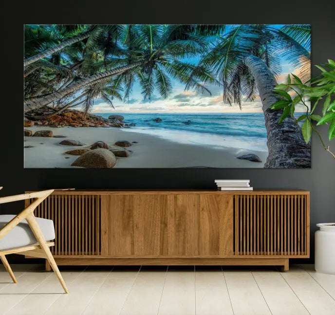 The "Tropical Beach Wall Art Ocean Canvas Print" features palm trees and ocean scenery on museum-quality polycotton canvas. This ready-to-hang piece is perfect for adding a coastal vibe to your space.