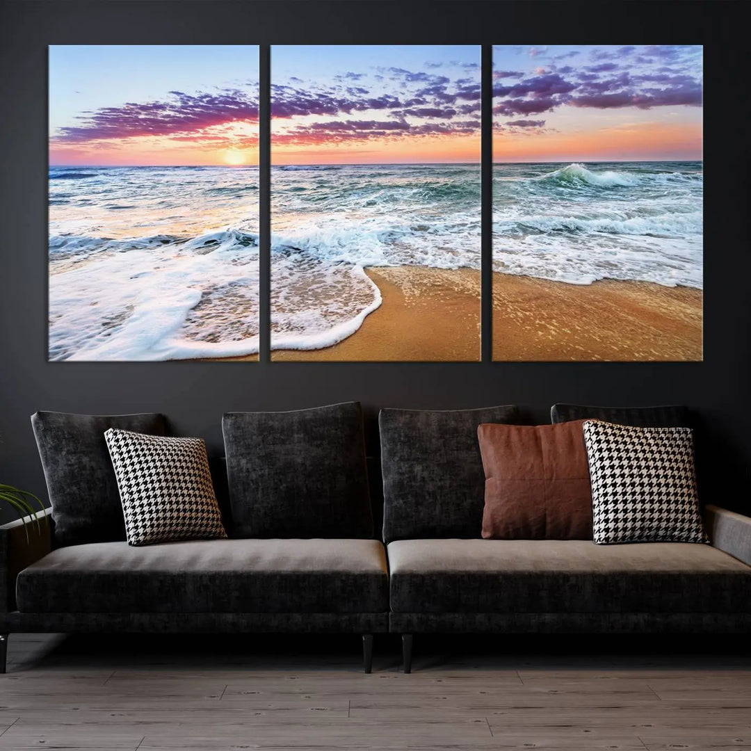 A triptych canvas wall art featuring the Tropical Beach Waves Art Print with a sunset ocean seascape adds striking beauty and perfectly complements the modern living room’s coastal decor.