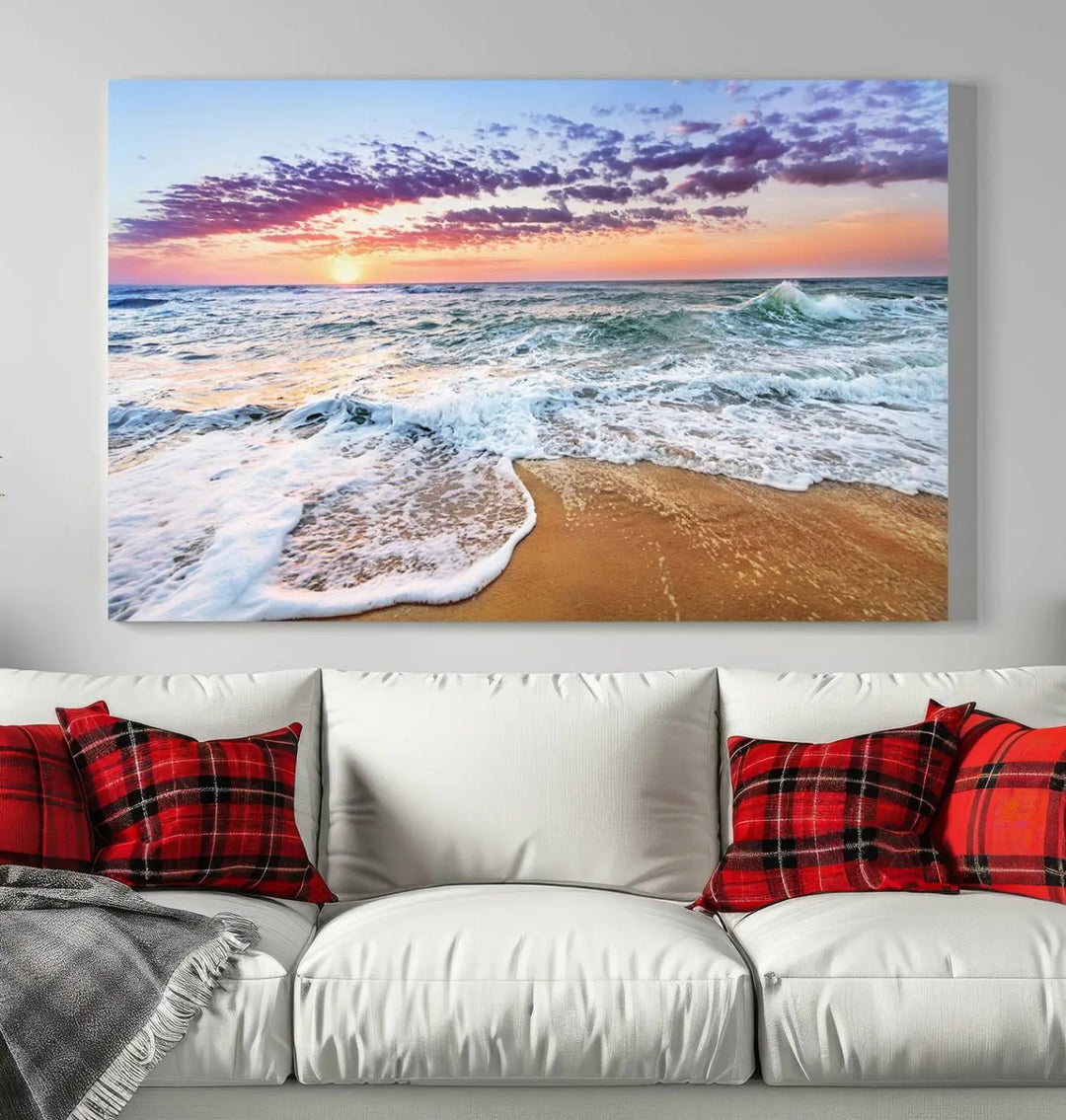 A triptych canvas wall art featuring the Tropical Beach Waves Art Print with a sunset ocean seascape adds striking beauty and perfectly complements the modern living room’s coastal decor.