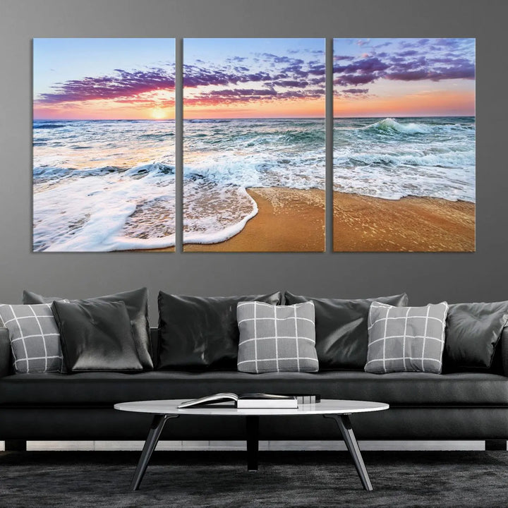 A triptych canvas wall art featuring the Tropical Beach Waves Art Print with a sunset ocean seascape adds striking beauty and perfectly complements the modern living room’s coastal decor.