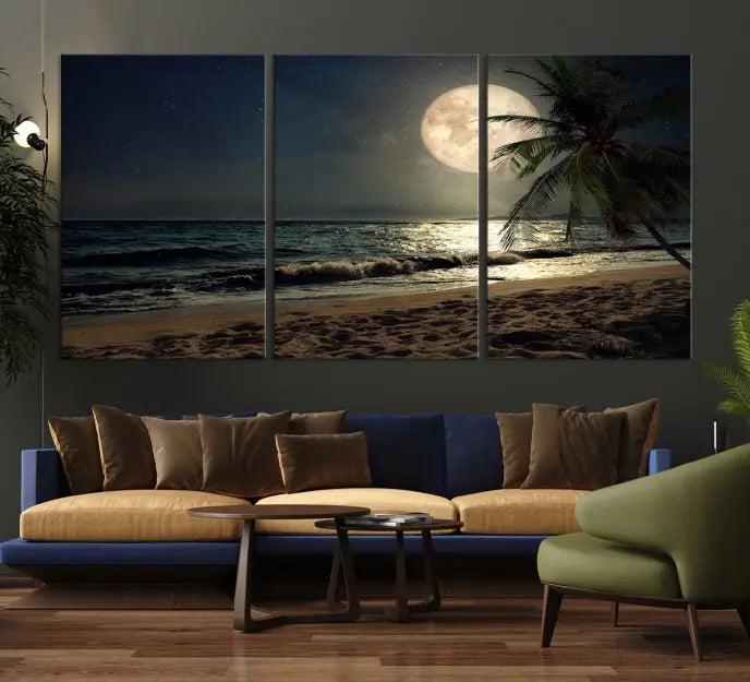 The Tropical Beach and Moon Wall Art Canvas Print features a stunning three-panel artwork of a moonlit beach, complete with waves and a palm tree beneath a starry night sky. It is displayed on museum-quality canvas with an elegant gallery wrap and includes a UV-protective coating for enduring beauty.