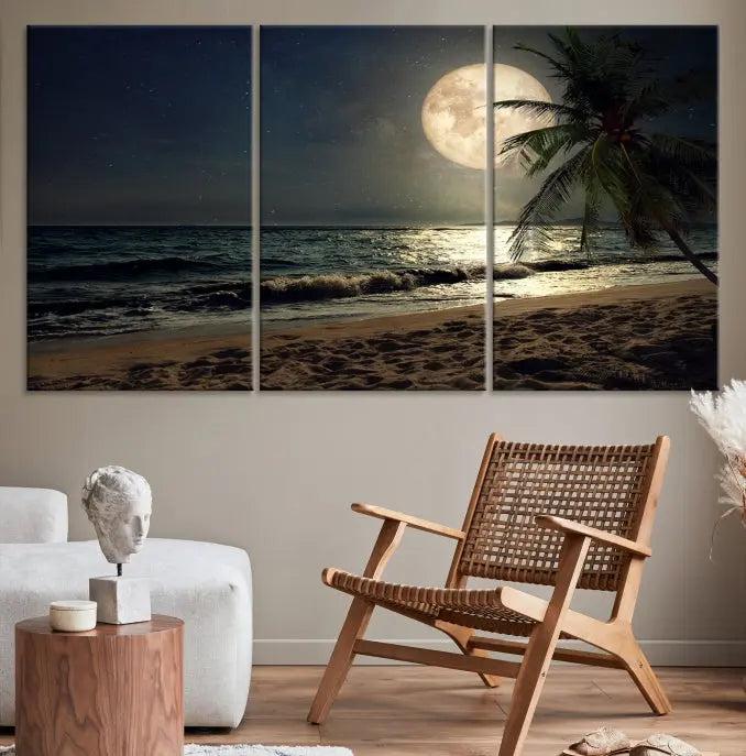 The Tropical Beach and Moon Wall Art Canvas Print features a stunning three-panel artwork of a moonlit beach, complete with waves and a palm tree beneath a starry night sky. It is displayed on museum-quality canvas with an elegant gallery wrap and includes a UV-protective coating for enduring beauty.