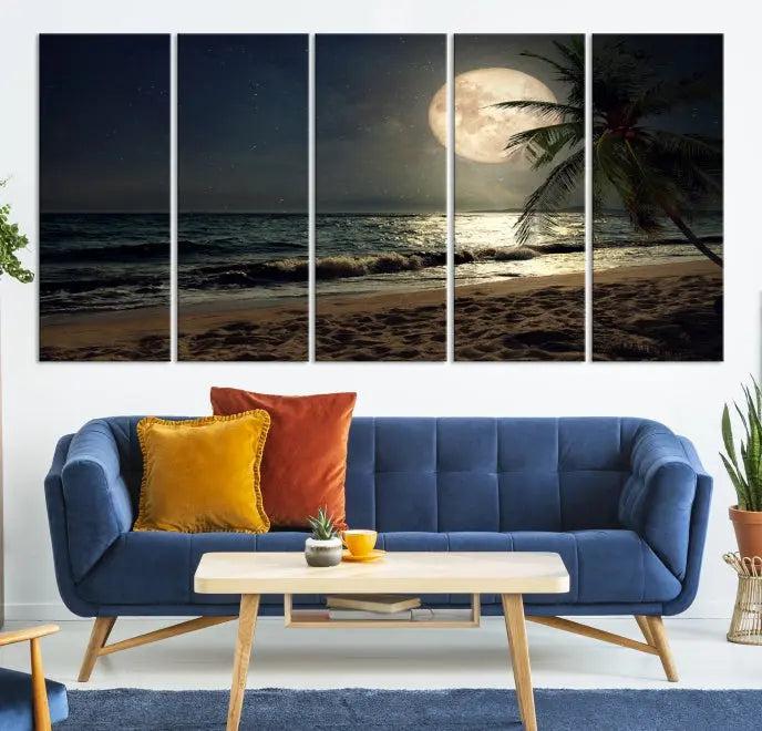 The Tropical Beach and Moon Wall Art Canvas Print features a stunning three-panel artwork of a moonlit beach, complete with waves and a palm tree beneath a starry night sky. It is displayed on museum-quality canvas with an elegant gallery wrap and includes a UV-protective coating for enduring beauty.