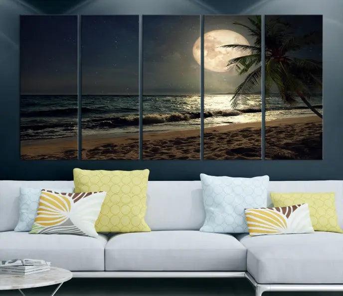 The Tropical Beach and Moon Wall Art Canvas Print features a stunning three-panel artwork of a moonlit beach, complete with waves and a palm tree beneath a starry night sky. It is displayed on museum-quality canvas with an elegant gallery wrap and includes a UV-protective coating for enduring beauty.