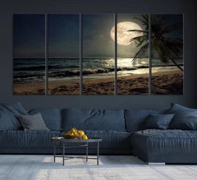 The Tropical Beach and Moon Wall Art Canvas Print features a stunning three-panel artwork of a moonlit beach, complete with waves and a palm tree beneath a starry night sky. It is displayed on museum-quality canvas with an elegant gallery wrap and includes a UV-protective coating for enduring beauty.