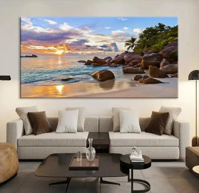 In a cozy living room, the "Tropical Island Beach Sunset Canvas Print," crafted on museum-quality canvas, hangs on the wall.