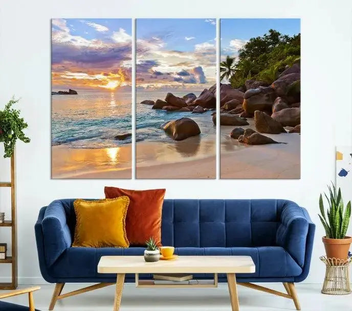 In a cozy living room, the "Tropical Island Beach Sunset Canvas Print," crafted on museum-quality canvas, hangs on the wall.