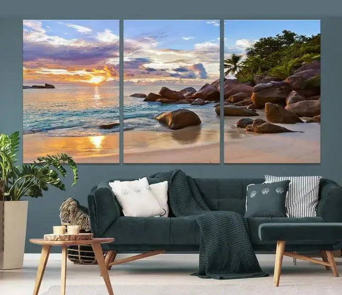 In a cozy living room, the "Tropical Island Beach Sunset Canvas Print," crafted on museum-quality canvas, hangs on the wall.