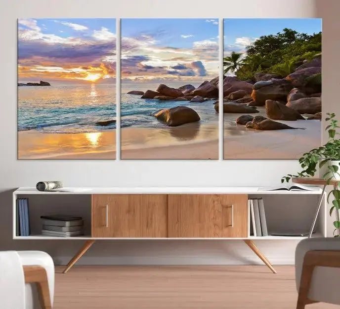 In a cozy living room, the "Tropical Island Beach Sunset Canvas Print," crafted on museum-quality canvas, hangs on the wall.