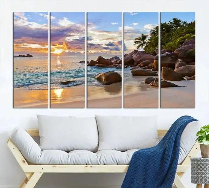 In a cozy living room, the "Tropical Island Beach Sunset Canvas Print," crafted on museum-quality canvas, hangs on the wall.