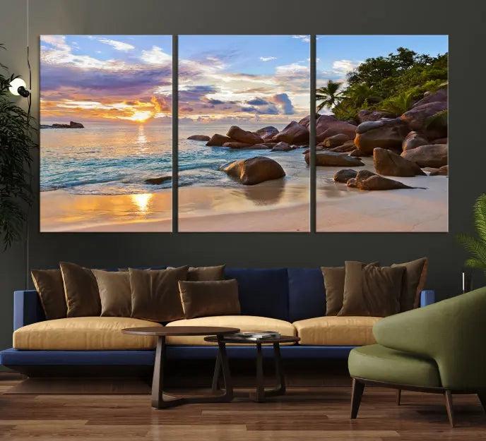 In a cozy living room, the "Tropical Island Beach Sunset Canvas Print," crafted on museum-quality canvas, hangs on the wall.