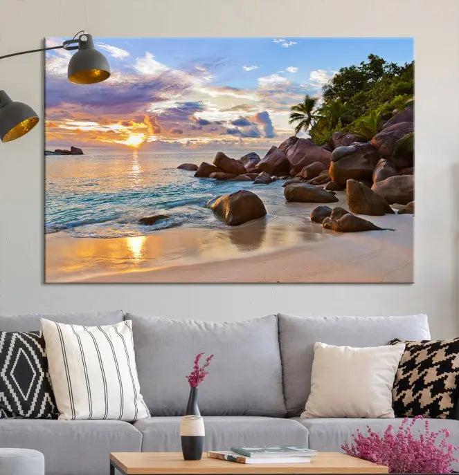 In a cozy living room, the "Tropical Island Beach Sunset Canvas Print," crafted on museum-quality canvas, hangs on the wall.