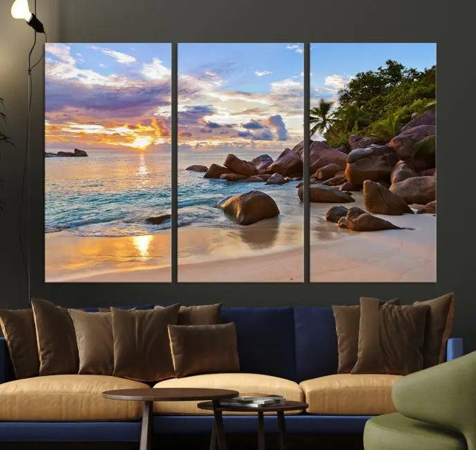 In a cozy living room, the "Tropical Island Beach Sunset Canvas Print," crafted on museum-quality canvas, hangs on the wall.