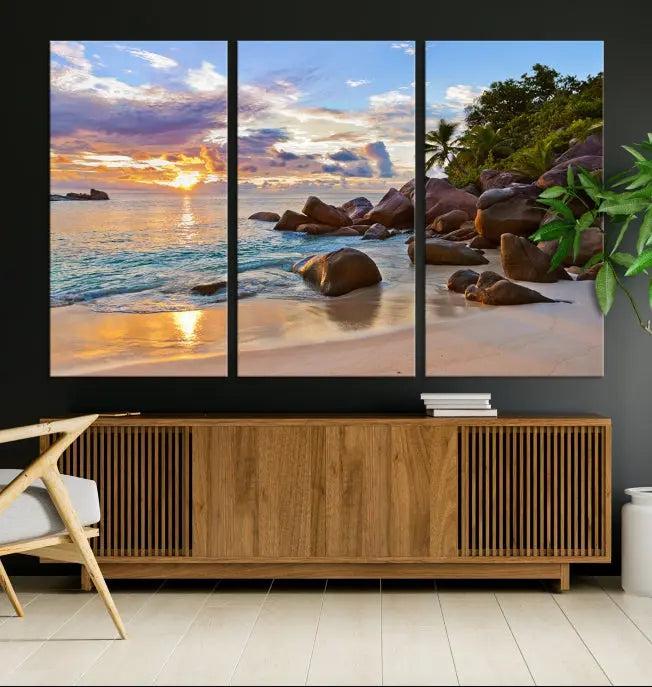 In a cozy living room, the "Tropical Island Beach Sunset Canvas Print," crafted on museum-quality canvas, hangs on the wall.