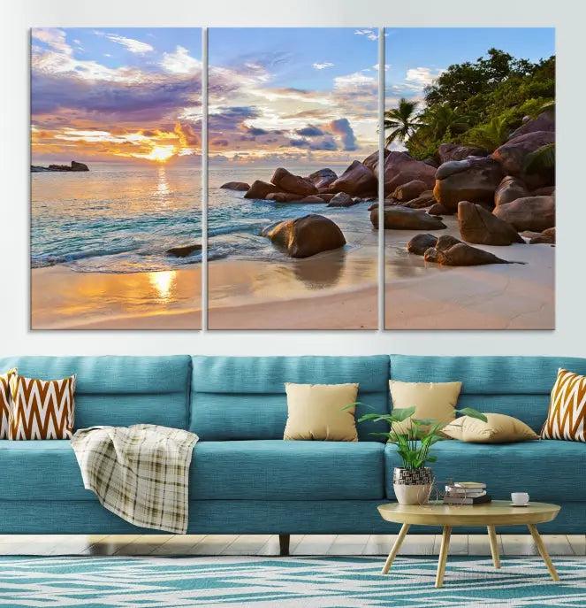 In a cozy living room, the "Tropical Island Beach Sunset Canvas Print," crafted on museum-quality canvas, hangs on the wall.