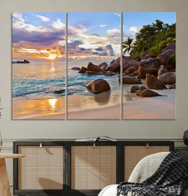 In a cozy living room, the "Tropical Island Beach Sunset Canvas Print," crafted on museum-quality canvas, hangs on the wall.