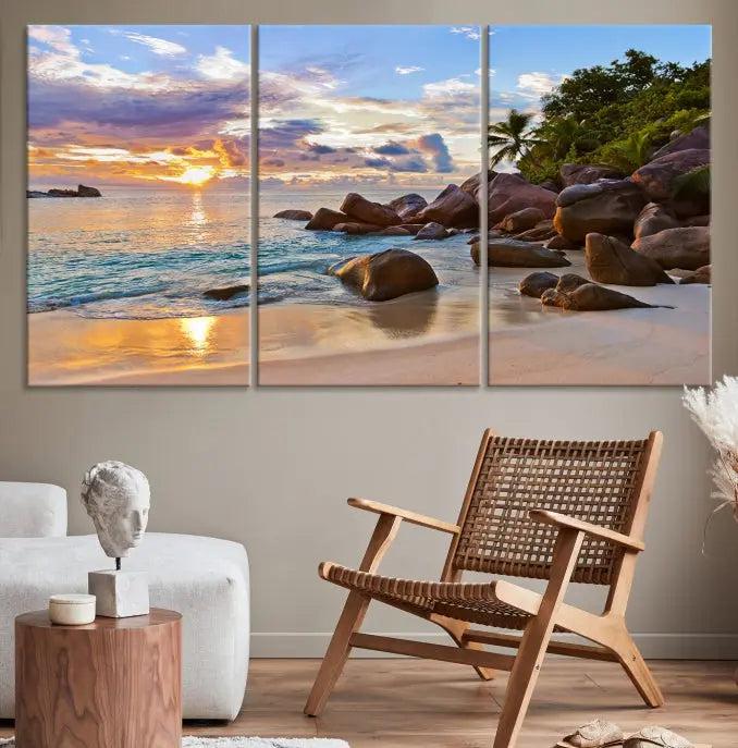 In a cozy living room, the "Tropical Island Beach Sunset Canvas Print," crafted on museum-quality canvas, hangs on the wall.