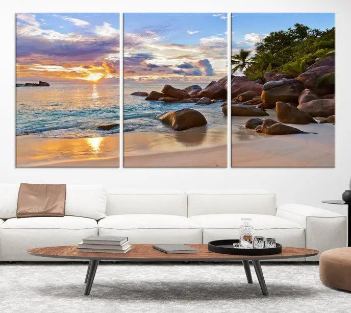 In a cozy living room, the "Tropical Island Beach Sunset Canvas Print," crafted on museum-quality canvas, hangs on the wall.