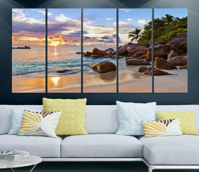 In a cozy living room, the "Tropical Island Beach Sunset Canvas Print," crafted on museum-quality canvas, hangs on the wall.