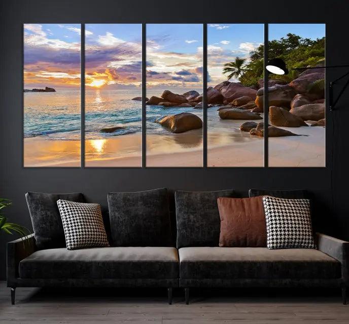 In a cozy living room, the "Tropical Island Beach Sunset Canvas Print," crafted on museum-quality canvas, hangs on the wall.