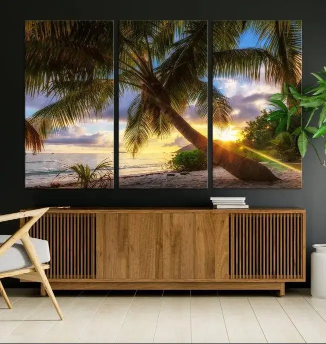 The Tropical Island Sunset on the Beach Palms Wall Art Canvas Print, featuring a gallery-wrapped finish, adds a stunning visual element to the space.