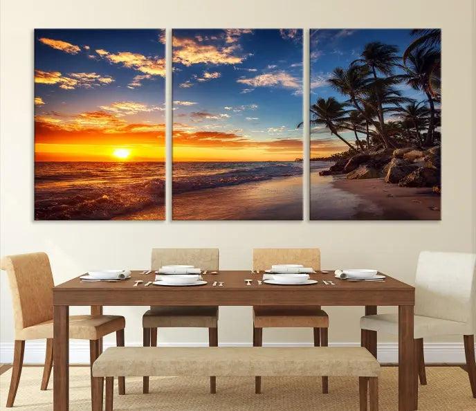 A living room featuring the Tropical Island Wall Art Canvas Print Sunset Artwork Print, a triptych displaying a beach sunset on museum-quality canvas with UV-protective coating, is prepared to hang.