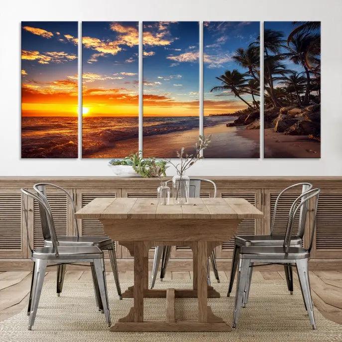 A living room featuring the Tropical Island Wall Art Canvas Print Sunset Artwork Print, a triptych displaying a beach sunset on museum-quality canvas with UV-protective coating, is prepared to hang.