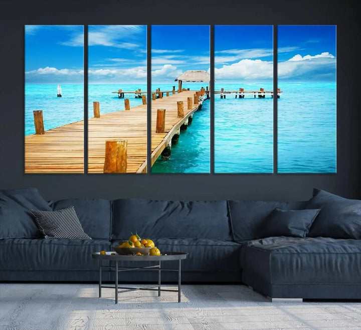 The Tropical Pier Triptych Wall Art is a captivating canvas print featuring a turquoise ocean and a wooden dock, ideal for coastal beach house decor.