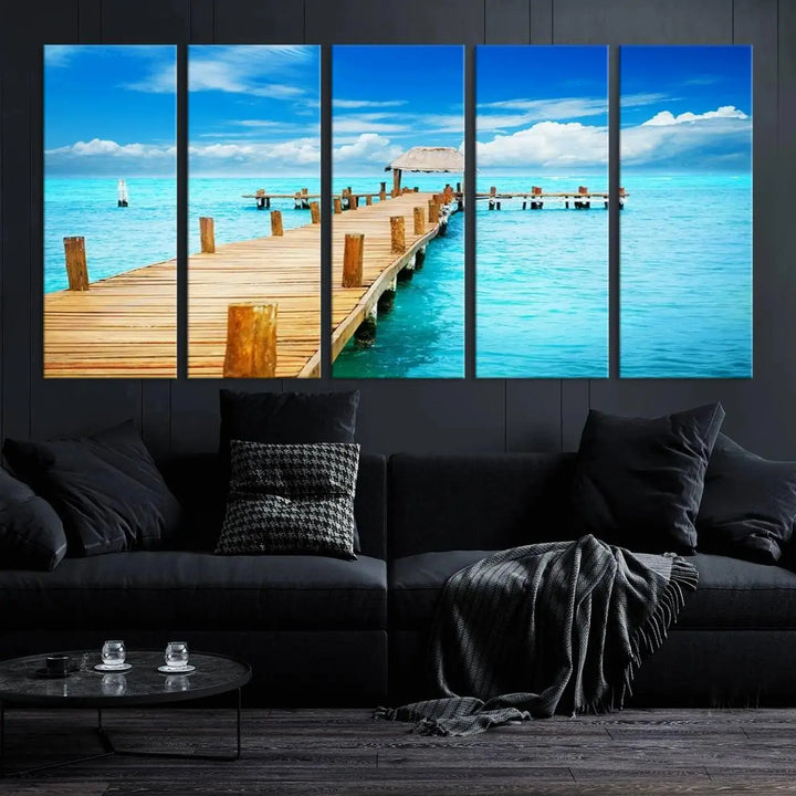 The Tropical Pier Triptych Wall Art is a captivating canvas print featuring a turquoise ocean and a wooden dock, ideal for coastal beach house decor.