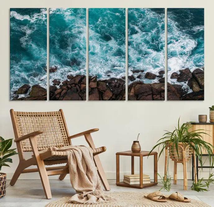 The Turquoise Aerial Wall Art Canvas Print, featuring a triptych of ocean waves crashing on rocks and printed on museum-quality canvas with a UV-protective coating, adds an exquisite touch to your living space. The gallery-wrapped pieces create a striking visual display.