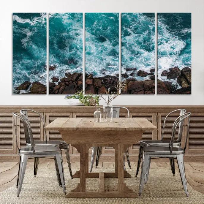 The Turquoise Aerial Wall Art Canvas Print, featuring a triptych of ocean waves crashing on rocks and printed on museum-quality canvas with a UV-protective coating, adds an exquisite touch to your living space. The gallery-wrapped pieces create a striking visual display.