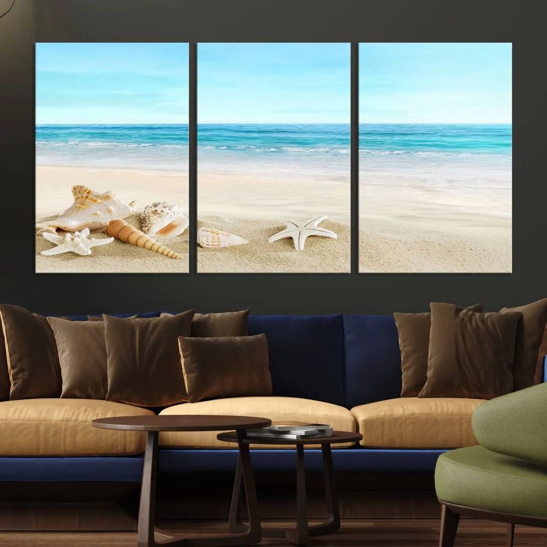 The "Turquoise Ocean View Seashell Starfish on the Beach Canvas Print Artwork" is a triptych piece that showcases a tranquil beach scene, complete with seashells and starfish adorning the sand. It is elegantly gallery-wrapped on museum-quality canvas.