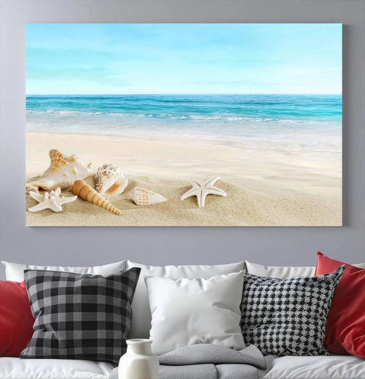 The "Turquoise Ocean View Seashell Starfish on the Beach Canvas Print Artwork" is a triptych piece that showcases a tranquil beach scene, complete with seashells and starfish adorning the sand. It is elegantly gallery-wrapped on museum-quality canvas.