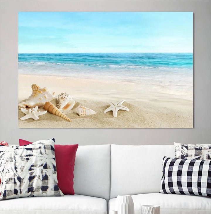 The "Turquoise Ocean View Seashell Starfish on the Beach Canvas Print Artwork" is a triptych piece that showcases a tranquil beach scene, complete with seashells and starfish adorning the sand. It is elegantly gallery-wrapped on museum-quality canvas.