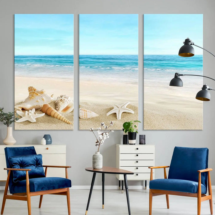 The "Turquoise Ocean View Seashell Starfish on the Beach Canvas Print Artwork" is a triptych piece that showcases a tranquil beach scene, complete with seashells and starfish adorning the sand. It is elegantly gallery-wrapped on museum-quality canvas.