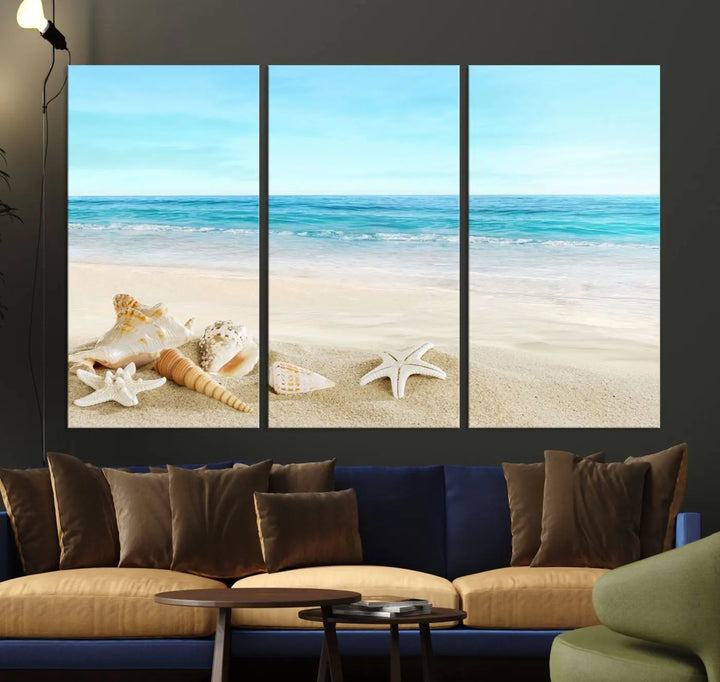 The "Turquoise Ocean View Seashell Starfish on the Beach Canvas Print Artwork" is a triptych piece that showcases a tranquil beach scene, complete with seashells and starfish adorning the sand. It is elegantly gallery-wrapped on museum-quality canvas.