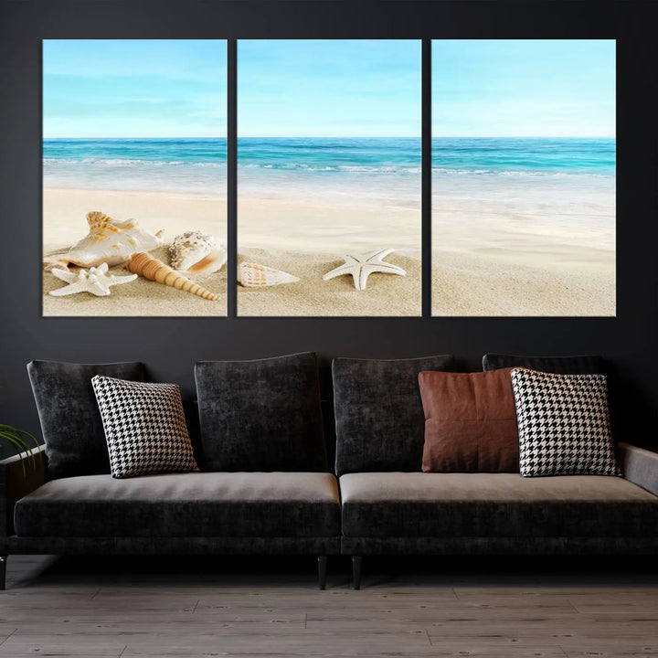 The "Turquoise Ocean View Seashell Starfish on the Beach Canvas Print Artwork" is a triptych piece that showcases a tranquil beach scene, complete with seashells and starfish adorning the sand. It is elegantly gallery-wrapped on museum-quality canvas.