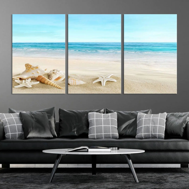 The "Turquoise Ocean View Seashell Starfish on the Beach Canvas Print Artwork" is a triptych piece that showcases a tranquil beach scene, complete with seashells and starfish adorning the sand. It is elegantly gallery-wrapped on museum-quality canvas.