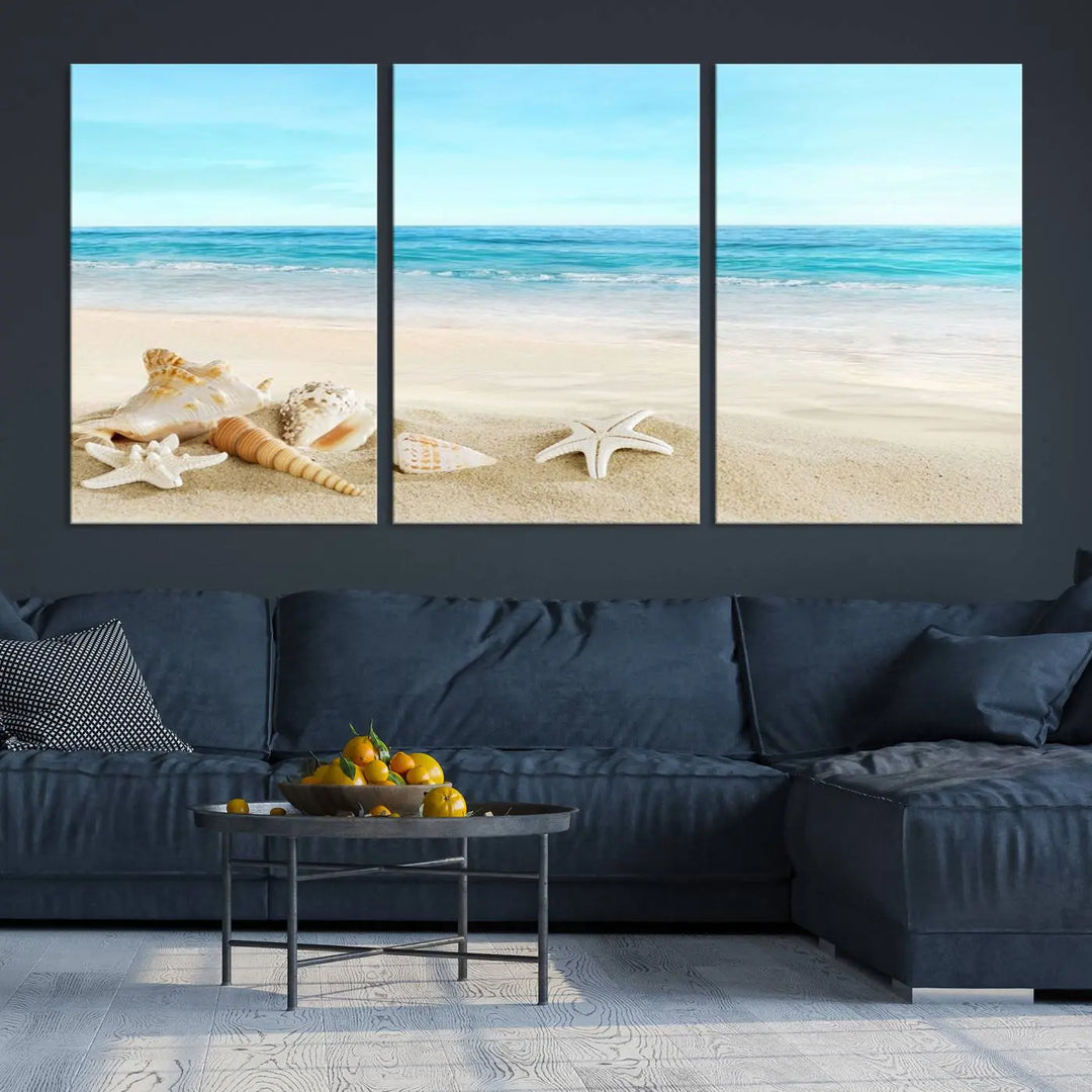 The "Turquoise Ocean View Seashell Starfish on the Beach Canvas Print Artwork" is a triptych piece that showcases a tranquil beach scene, complete with seashells and starfish adorning the sand. It is elegantly gallery-wrapped on museum-quality canvas.