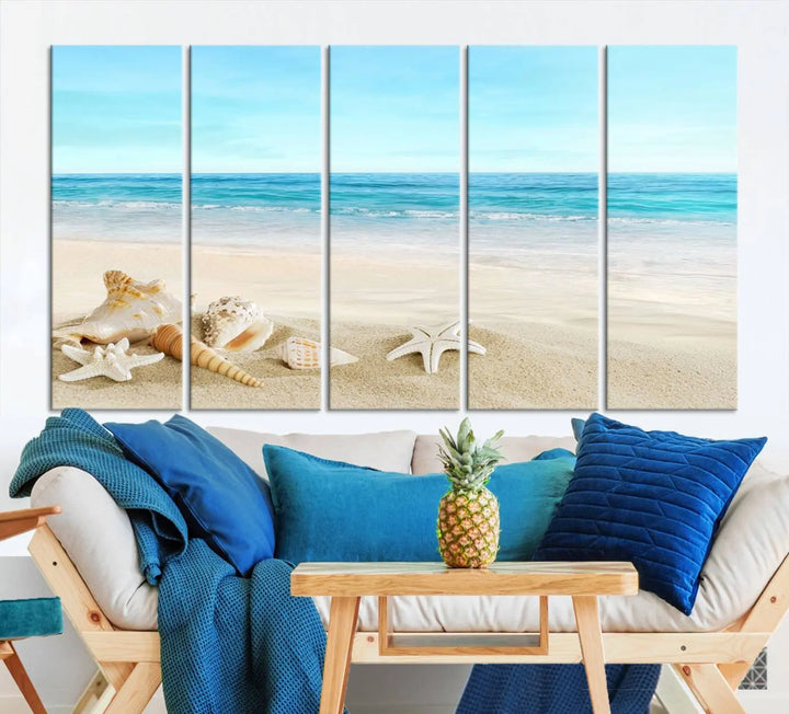 The "Turquoise Ocean View Seashell Starfish on the Beach Canvas Print Artwork" is a triptych piece that showcases a tranquil beach scene, complete with seashells and starfish adorning the sand. It is elegantly gallery-wrapped on museum-quality canvas.