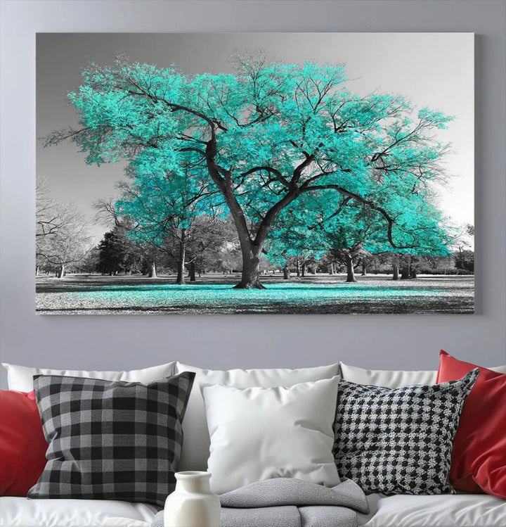 The "Turquoise Tree Canvas Wall Art Multi Piece Canvas Print" features a stunning triptych of a tree with turquoise leaves, printed on museum-quality canvas and coated for UV protection. The artwork arrives ready to hang, instantly enhancing the charm of your space.