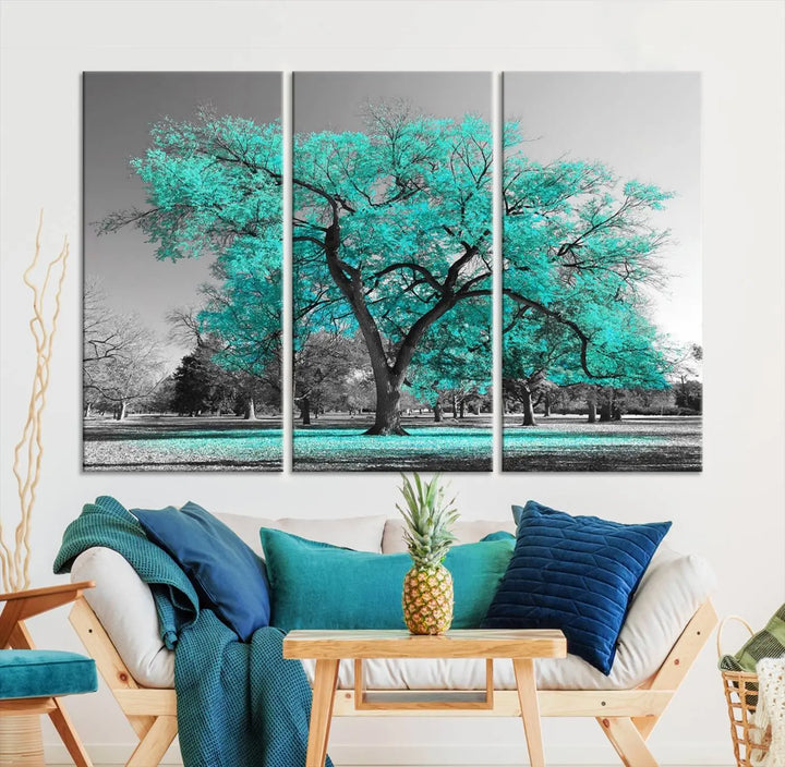 The "Turquoise Tree Canvas Wall Art Multi Piece Canvas Print" features a stunning triptych of a tree with turquoise leaves, printed on museum-quality canvas and coated for UV protection. The artwork arrives ready to hang, instantly enhancing the charm of your space.