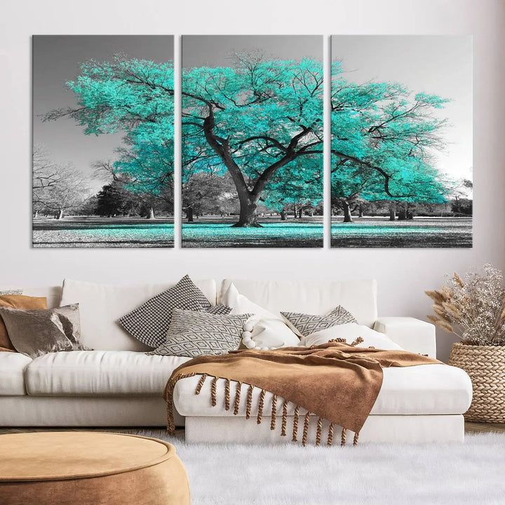 The "Turquoise Tree Canvas Wall Art Multi Piece Canvas Print" features a stunning triptych of a tree with turquoise leaves, printed on museum-quality canvas and coated for UV protection. The artwork arrives ready to hang, instantly enhancing the charm of your space.